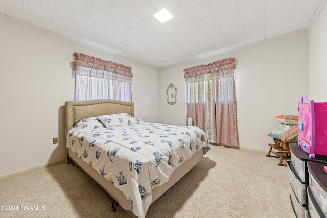 carpeted bedroom featuring crown molding