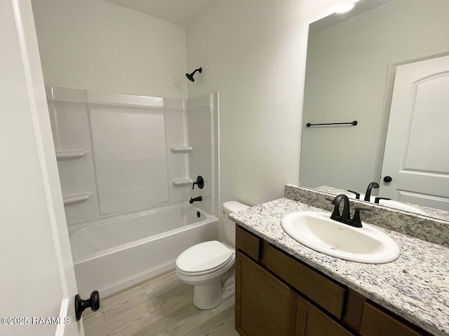 bathroom with shower / bath combination, toilet, vanity, and wood finished floors