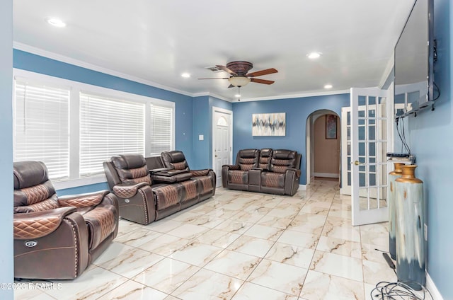 living room with crown molding and ceiling fan