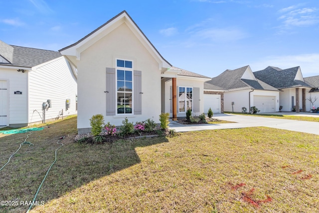 view of front of property with stucco siding, an attached garage, concrete driveway, and a front lawn