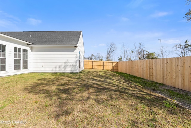 view of yard with a fenced backyard