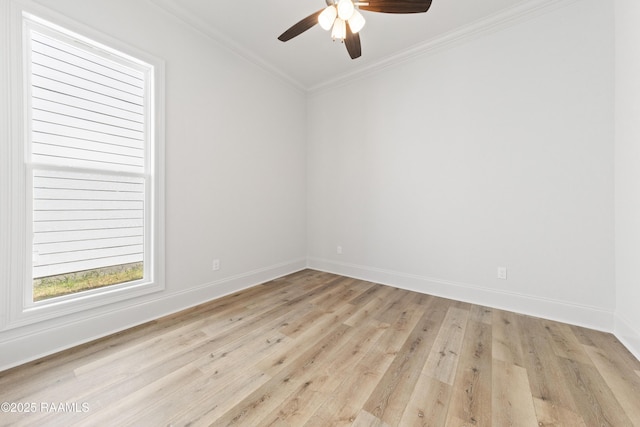 empty room with light wood-style flooring, a ceiling fan, baseboards, and ornamental molding