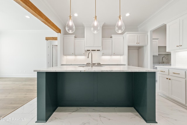 kitchen with marble finish floor, white cabinetry, and ornamental molding