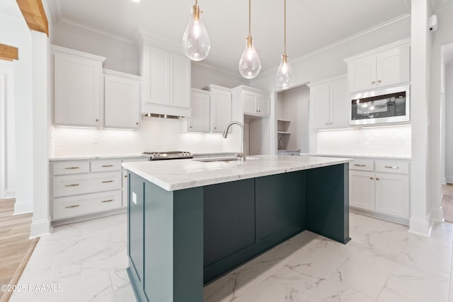 kitchen featuring crown molding, marble finish floor, and stainless steel appliances