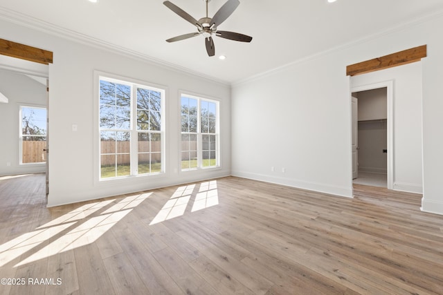 unfurnished living room featuring recessed lighting, baseboards, light wood-style flooring, and crown molding