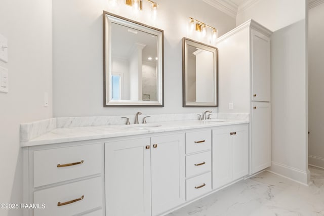 bathroom featuring crown molding, double vanity, marble finish floor, and a sink