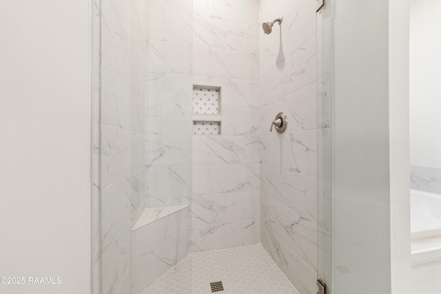 full bath with a shower stall