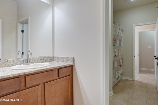 bathroom with vanity, a shower with shower curtain, and tile patterned floors