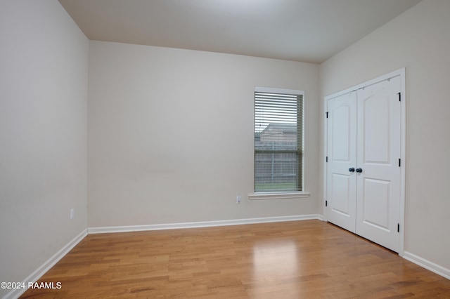 spare room featuring light hardwood / wood-style floors