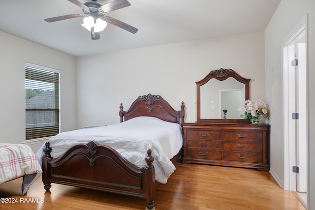 bedroom with light wood-type flooring and ceiling fan