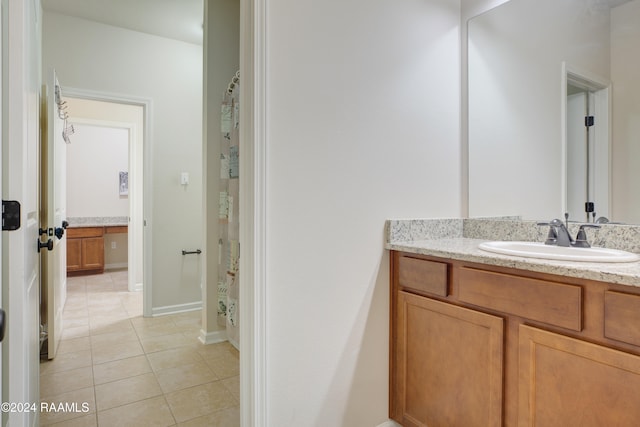 bathroom featuring vanity, a shower with curtain, and tile patterned flooring