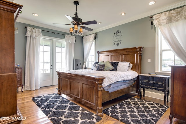 bedroom with ceiling fan, light wood-type flooring, and crown molding