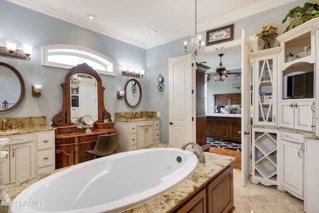 bathroom with a bathtub, tile patterned floors, ornamental molding, vanity, and a chandelier