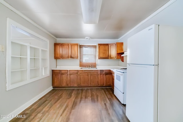 kitchen with sink, white appliances, wood-type flooring, range hood, and crown molding