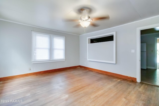 unfurnished room featuring ornamental molding, light hardwood / wood-style flooring, and ceiling fan