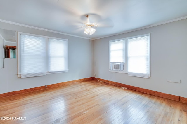 empty room with ceiling fan, light wood-type flooring, and crown molding