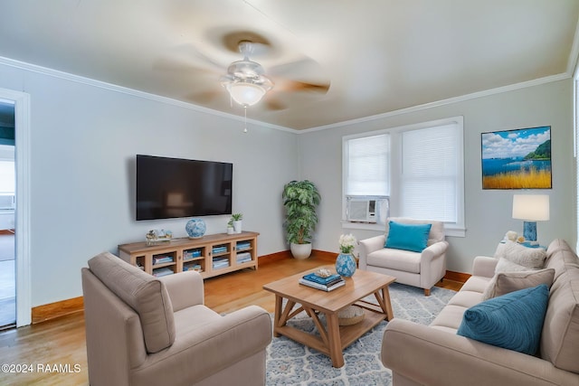 living room with light wood-type flooring, ceiling fan, and crown molding