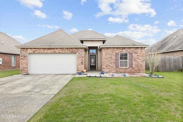 view of front facade with a garage and a front yard