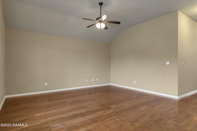 spare room with hardwood / wood-style flooring, ceiling fan, and lofted ceiling