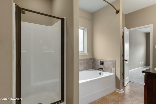 bathroom featuring tile patterned floors, vanity, and plus walk in shower