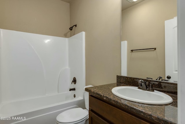 full bathroom with vanity, bathing tub / shower combination, and toilet