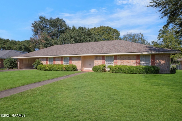 ranch-style house with a front yard