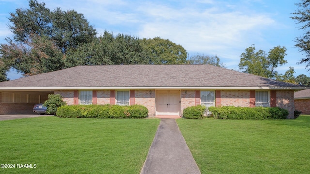 single story home featuring a front yard and a carport