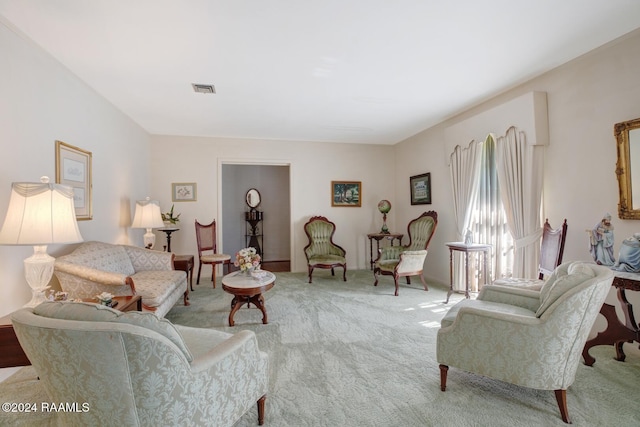 living area with light colored carpet