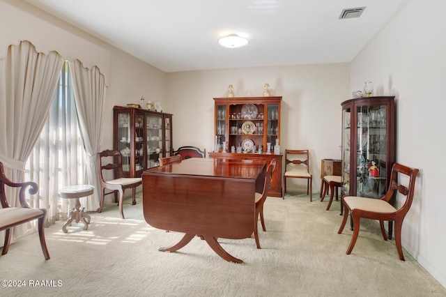 sitting room featuring light colored carpet