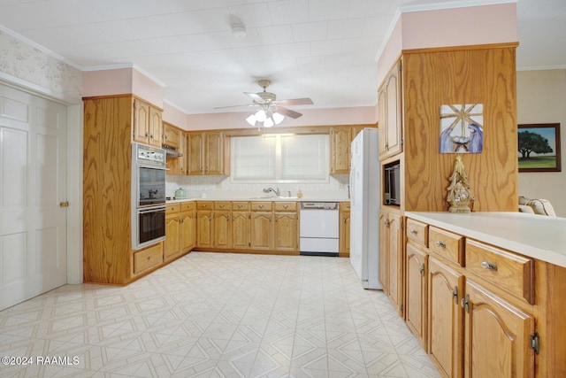 kitchen with sink, crown molding, white appliances, and ceiling fan