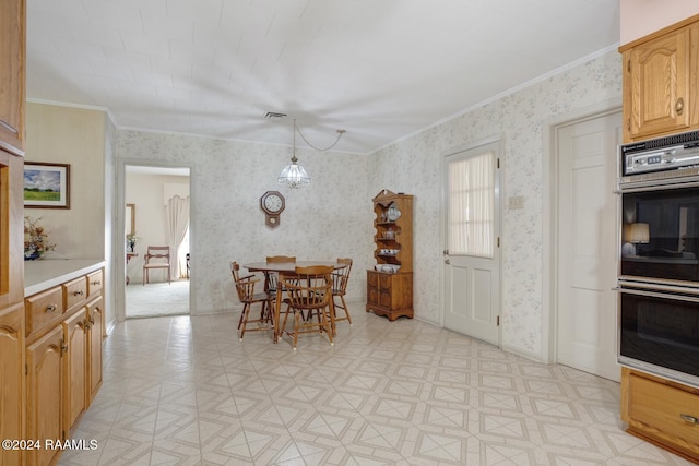 dining room featuring crown molding