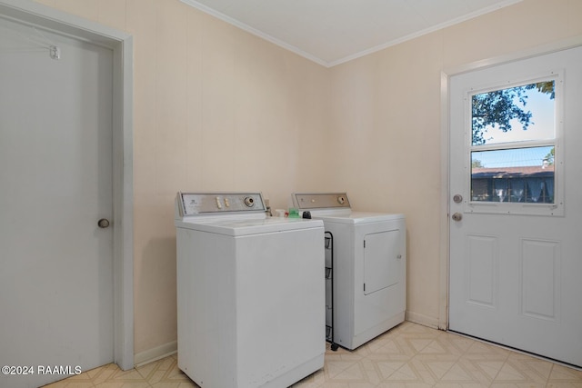 washroom with crown molding and washer and dryer