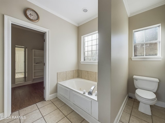 bathroom with tile patterned floors, a washtub, toilet, and crown molding