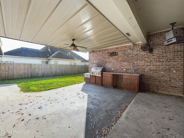 view of patio featuring area for grilling, ceiling fan, sink, and grilling area