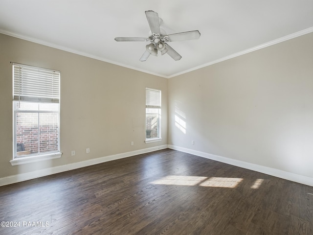 unfurnished room featuring ceiling fan, a healthy amount of sunlight, crown molding, and dark wood-type flooring