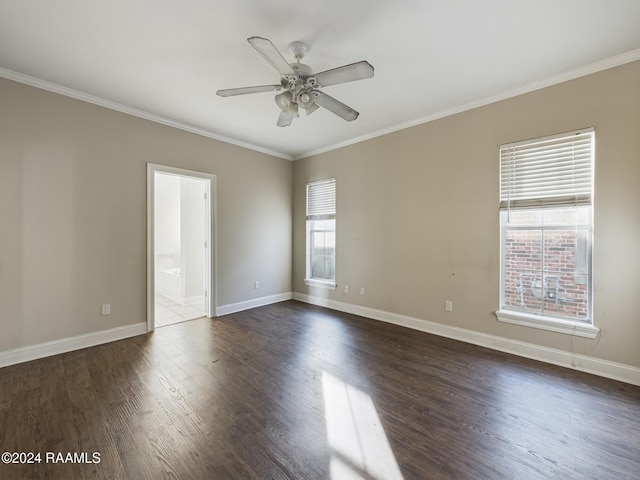 unfurnished room with ceiling fan, a healthy amount of sunlight, dark hardwood / wood-style floors, and ornamental molding