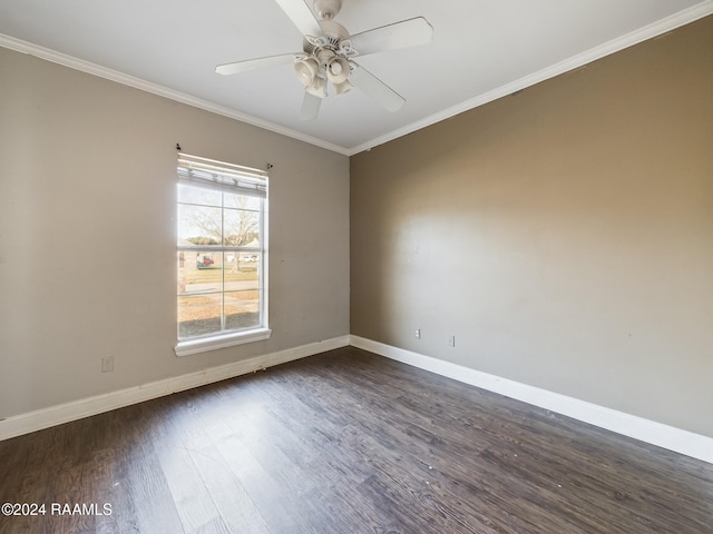 empty room with ceiling fan, dark wood-type flooring, and ornamental molding