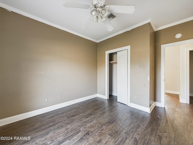 unfurnished bedroom featuring a closet, ceiling fan, ornamental molding, and dark hardwood / wood-style floors