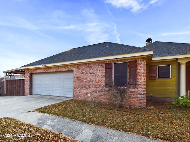 view of side of home with a garage