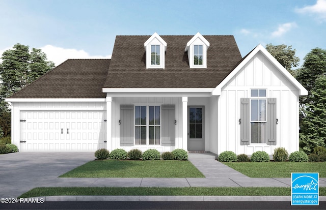 view of front of home featuring a garage and a front lawn