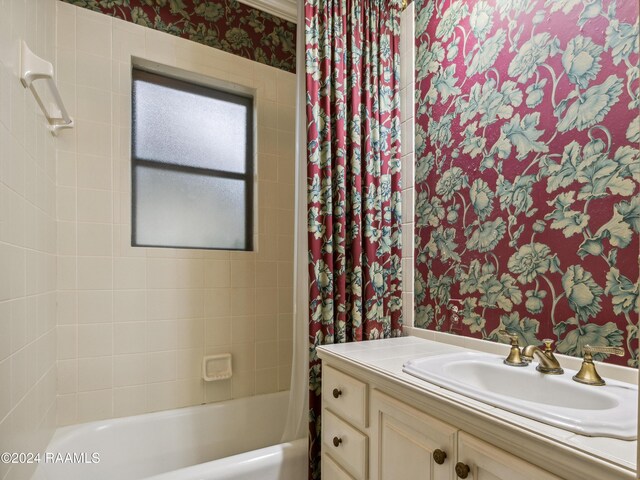 243 W Grolee St, Opelousas, LA 70570 - bathroom with vanity, shower / tub combo with curtain, and wallpapered walls