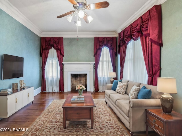 living room featuring hardwood / wood-style flooring, ceiling fan, a healthy amount of sunlight, and ornamental molding