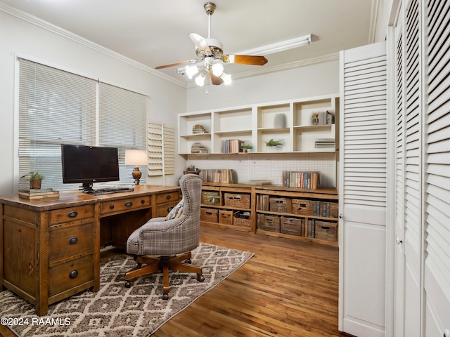 office featuring ceiling fan, wood-type flooring, and ornamental molding