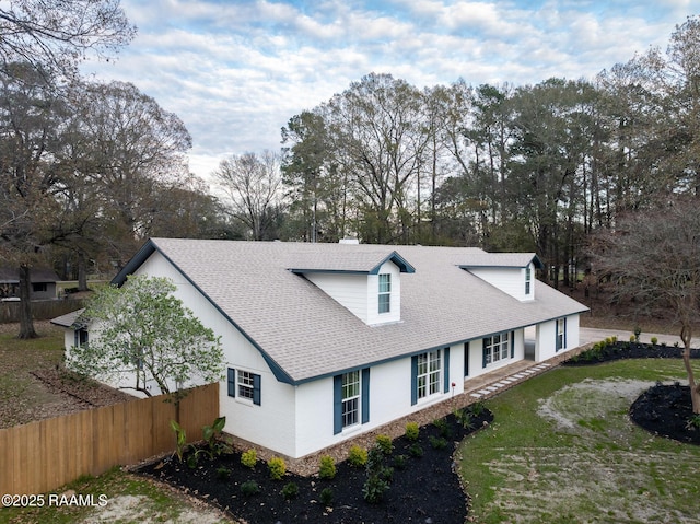 view of side of property with a yard