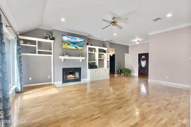 unfurnished living room with ceiling fan, lofted ceiling, crown molding, and light hardwood / wood-style floors