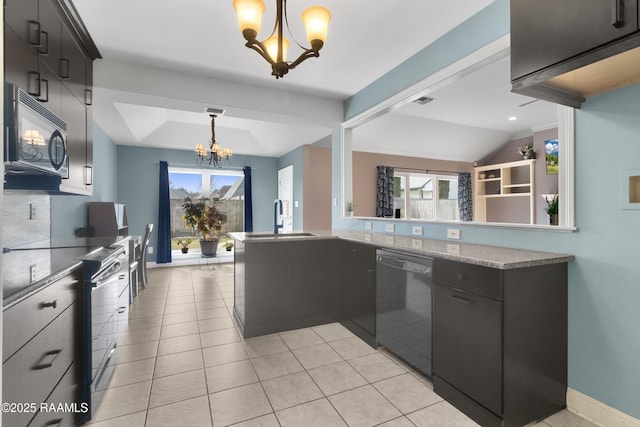 kitchen with plenty of natural light, a chandelier, hanging light fixtures, and black appliances