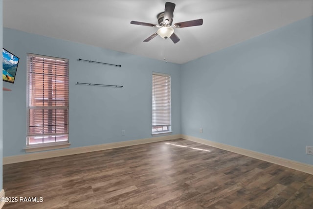 unfurnished room with hardwood / wood-style flooring and ceiling fan