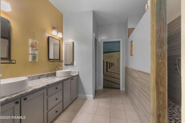 bathroom with tile patterned flooring and vanity