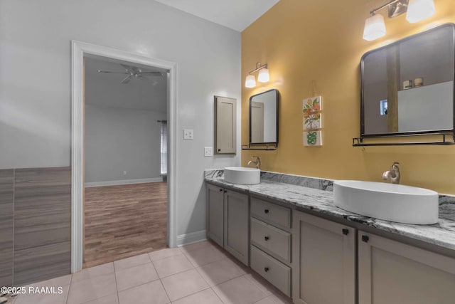 bathroom with ceiling fan, tile patterned floors, and vanity