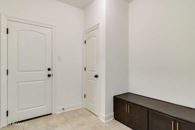 interior space featuring light tile patterned floors